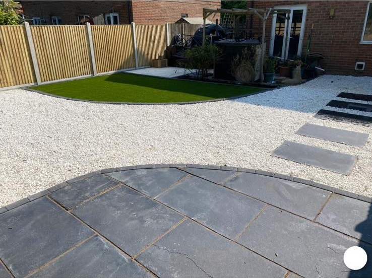 Gravel garden with stepping-stone path and curved lawn