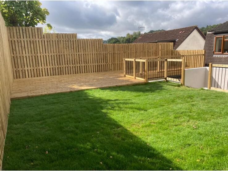 New close-board fence and freshly laid lawn in a Kent garden